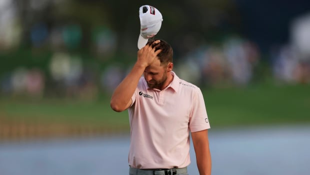 Wyndham Clark reacts to his missed putt on hole 18 that would have sent tournament play into a playoff during the fourth and final round of The Players Championship PGA golf tournament Sunday, March 17, 2024 at TPC Sawgrass in Ponte Vedra Beach, Fla. Scottie Scheffler won at 20 under par and is the first defending champion in the 50 year history of the event.